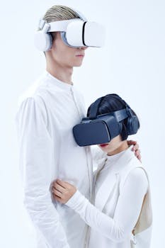 A man and woman wearing VR headsets experience a futuristic digital environment.