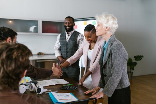 A group of diverse professionals engaged in a collaborative business meeting indoors.